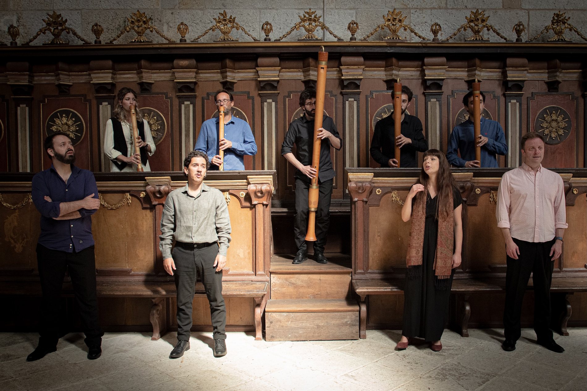 Arte Minima singing and playing recorders in the choir stalls of a Portuguese church